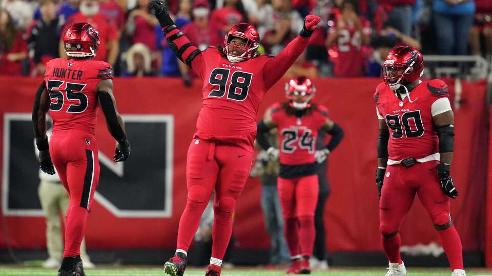 Houston Texans defensive tackle Tim Settle Jr. (98) reacts after sacking Buffalo Bills quarterback Josh Allen during the second half of an NFL football game in Houston, Thursday, Nov. 20, 2025.