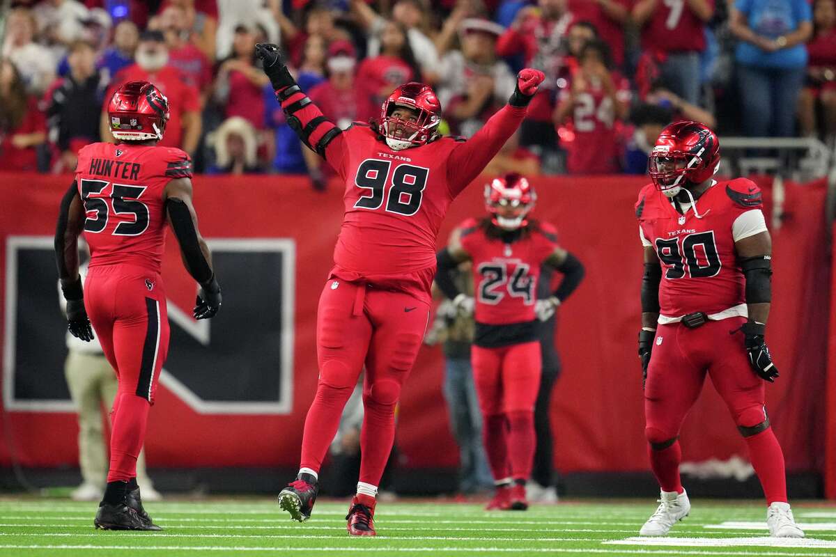 Houston Texans defensive tackle Tim Settle Jr. (98) reacts after sacking Buffalo Bills quarterback Josh Allen during the second half of an NFL football game in Houston, Thursday, Nov. 20, 2025.