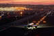 A Frontier Airlines Airbus A321 airplane taxis at San Diego International before a departure at sunset on May 10, 2025.