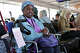 Jean Toney of Oakland waits to board a flight to San Diego to visit friends in Terminal 2 at Oakland San Francisco Bay Airport on Tuesday.