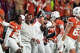 Texas Longhorns quarterback Arch Manning (16) give Texas Longhorns head coach Steve Sarkisian the game ball after beating Texas A&M Aggies 27-17 during the NCAA college football game in the Lone Star Showdown in Austin, Texas, Friday, Nov. 28, 2025.