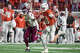 Texas Longhorns quarterback Arch Manning (16) runs into the end zone for a score against Texas A&M Aggies during the second half of an NCAA college football game in the Lone Star Showdown in Austin, Texas, Friday, Nov. 28, 2025.
