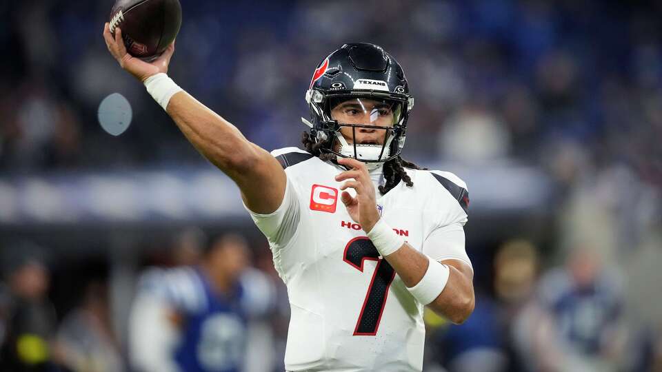 Houston Texans quarterback C.J. Stroud warms up before an NFL football game against the Indianapolis Colts in Indianapolis, Sunday, Nov. 30, 2025.