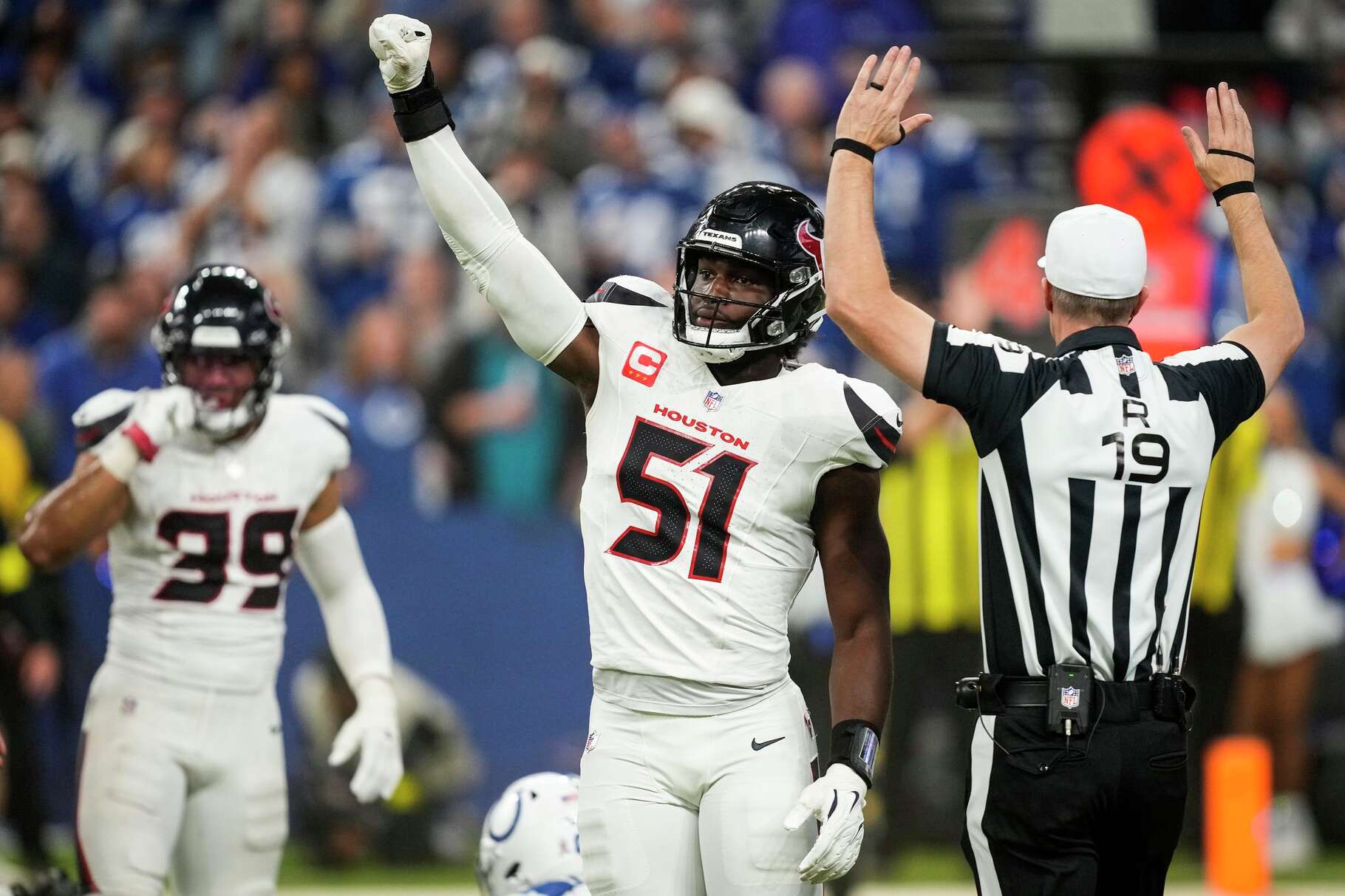 Houston Texans defensive end Will Anderson Jr. (51) reacts after the Texans stopped the Indianapolis Colts on fourth down, to turn the ball over on downs, during the first half of an NFL football game in Indianapolis, Sunday, Nov. 30, 2025.