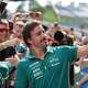 Driver Fernando Alonso taking a selfie with the crowd behind him at the AMF1.