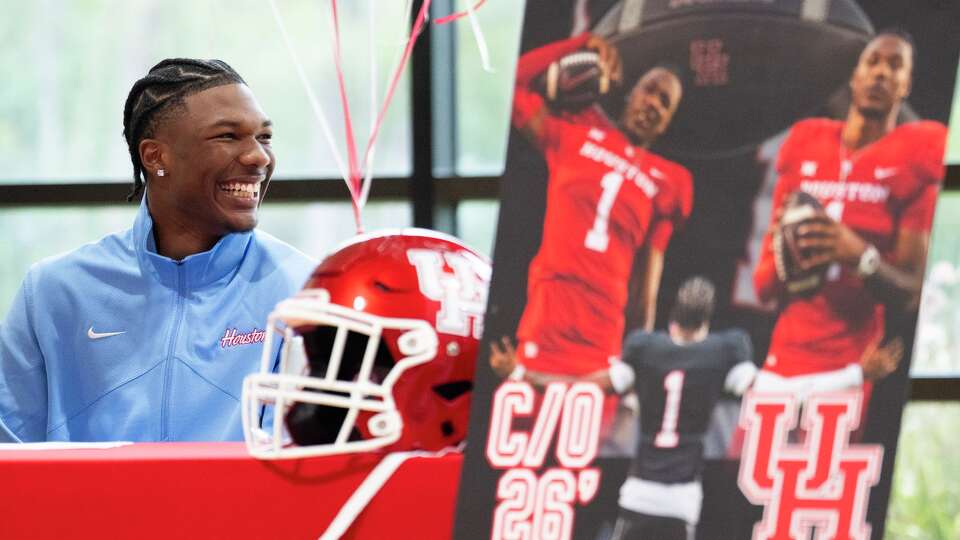 Legacy School of Sports Sciences quarterback Keisean Henderson smiles after announcing his signing to play football for the University of Houston on National Signing Say in Spring, Wednesday, Dec. 3, 2025.