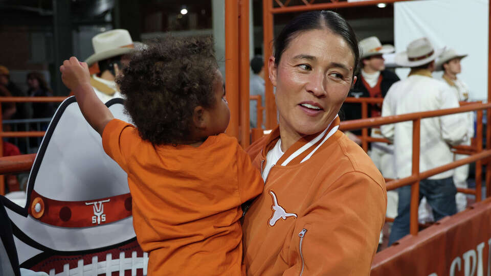 New Texas women's soccer coach Margueritte Bates on the field before the SEC football game between Longhorns and Aggies.