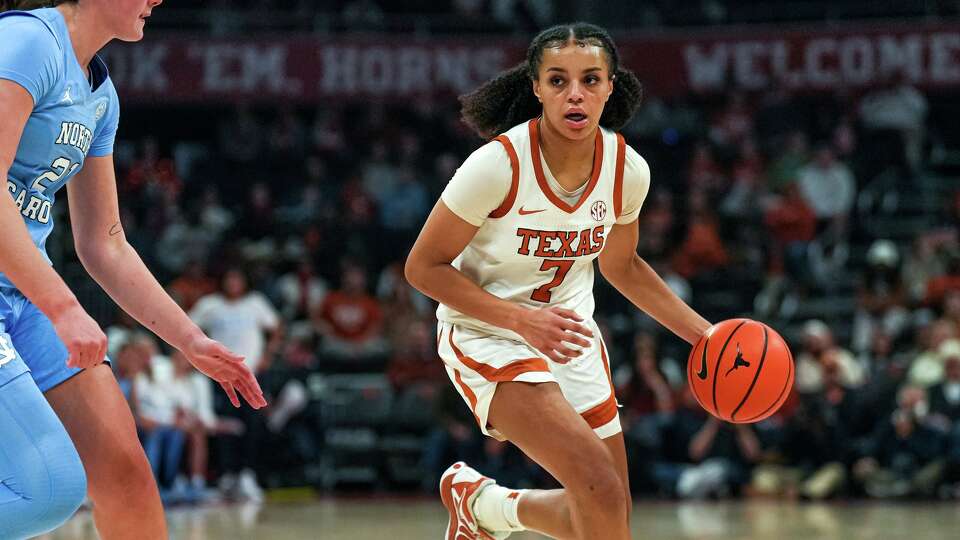 Texas Longhorns guard Jordan Lee (7) dribbles the ball towards the University of North Carolina basket during the game at the Moody Center on Thursday, Dec. 4, 2025 in Austin.