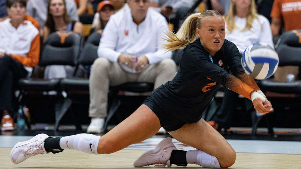 Texas Longhorns libero Emma Halter (2) dives for the ball as The Longhorns take on Florida A&M during the first round of the NCAA Tournament at Gregory Gymnasium in Austin, Friday, Dec. 5, 2025.