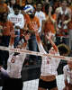 Texas Longhorns outside hitter Cari Spears (23) and middle blocker Ayden Ames (5) leap to block during the first set between Texas and the Penn State Nittany Lions in the second round of the DI NCAA Volleyball Tournament, Dec 6, 2025 in the Gregory Gymnasium.