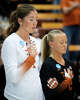 Texas Longhorns setter Ella Swindle (1) and libero Emma Halter (2) close their eyes during the National Anthem ahead of the their 3-0 win over the Penn State Nittany Lions in the second round of the DI NCAA Volleyball Tournament, Dec 6, 2025 in the Gregory Gymnasium.