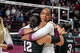Texas A&M middle blocker Ifenna Cos-Okpalla (1) hugs libero Ava Underwood (12) after winning the NCAA Division I volleyball playoff game against TCU at Reed Arena on Saturday, Dec. 6, 2025 in College Station, Texas.