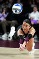 Texas A&M libero Ava Underwood (12) dives for a serve return during the NCAA Division I volleyball playoff game against TCU at Reed Arena on Saturday, Dec. 6, 2025 in College Station, Texas.