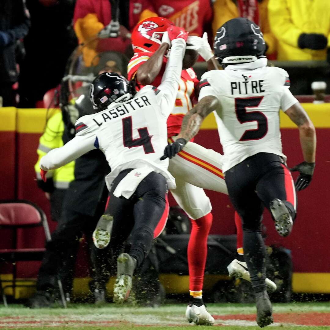 Houston Texans cornerback Kamari Lassiter (4) deflects a pass in the endzone against Kansas City Chiefs wide receiver Tyquan Thornton (80) during the second half an NFL football game in Kansas City, Mo., Sunday, Dec. 7, 2025.