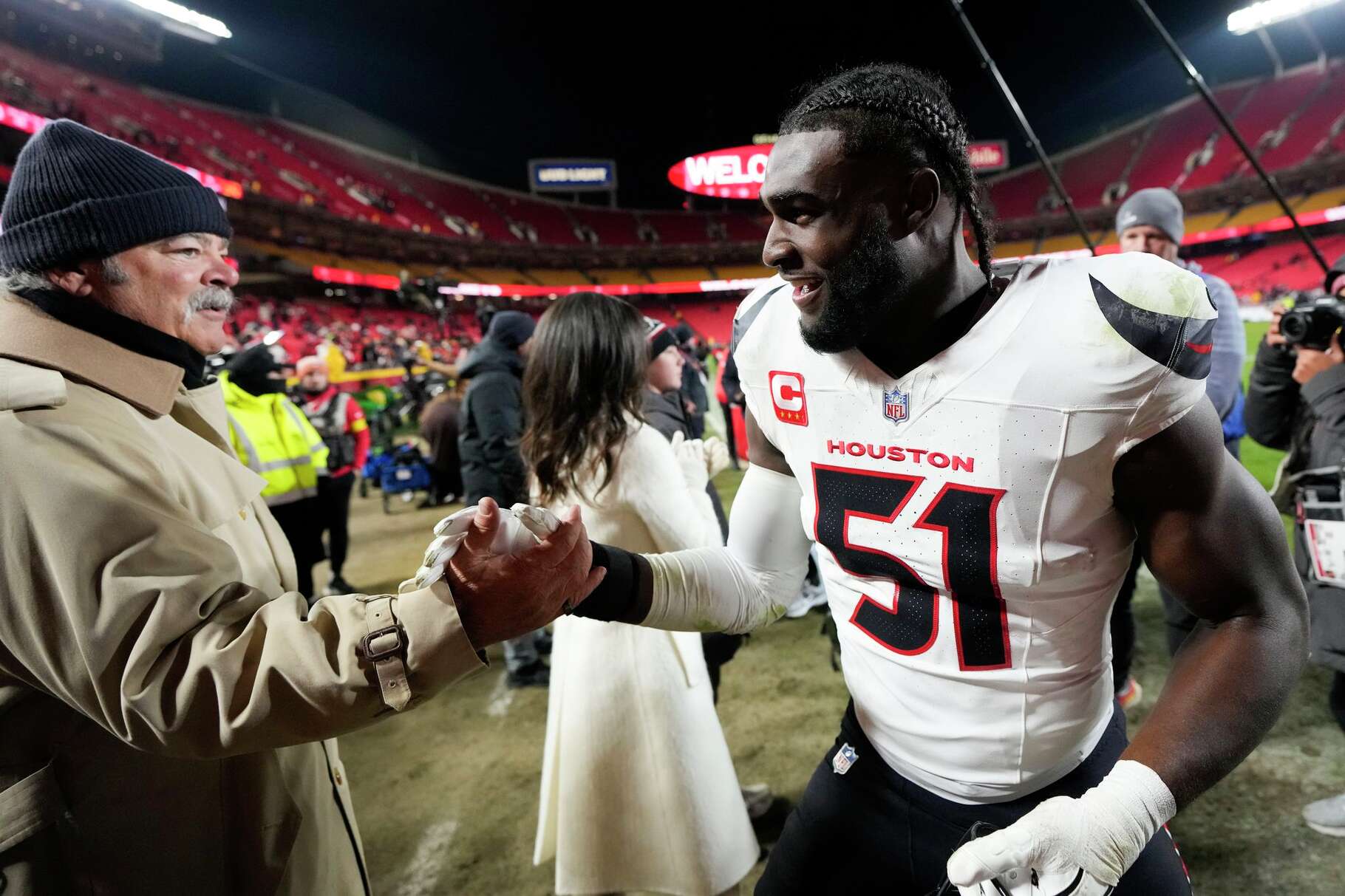 Houston Texans defensive end Will Anderson Jr. (51) greets Texans CEO Cal McNair after the team's 20-10 win over the Kansas City Chiefs during an NFL football game in Kansas City, Mo., Sunday, Dec. 7, 2025.