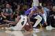 Los Angeles Lakers forward Rui Hachimura (28) fights for a loose ball with San Antonio Spurs guard De'Aaron Fox (4) during the first half of an NBA Cup basketball game Wednesday, Dec. 10, 2025, in Los Angeles. (AP Photo/Jae C. Hong)