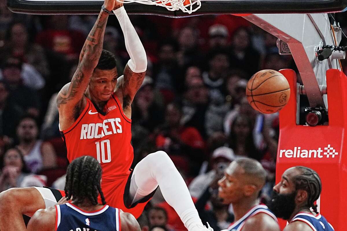 Houston Rockets forward Jabari Smith Jr. (10) dunks the ball over LA Clippers defense in the first half of game action at the Toyota Center in Houston on Thursday, Dec. 11, 2025.