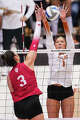 Texas Longhorns setter Ella Swindle (1) blocks a hit from Indiana Hoosiers outside hitter Candela Alonso-Corcelles (3) as Texas volleyball plays Indiana in a Sweet 16 NCAA Tournament match in Gregory Gymnasium in Austin, Friday, Dec. 12, 2025. The Longhorns will advance to Elite Eight with a 3-0 win.