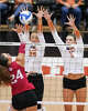 Texas Longhorns outside hitter Whitney Lauenstein (26) and Texas Longhorns middle blocker Ayden Ames (5) block a spike from Indiana Hoosiers outside hitter Jaidyn Jager (24) as Texas volleyball plays Indiana in a Sweet 16 NCAA Tournament match in Gregory Gymnasium in Austin, Friday, Dec. 12, 2025. The Longhorns will advance to Elite Eight with a 3-0 win.