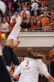 Texas Longhorns outside hitter Whitney Lauenstein (26) spikes the ball as Texas volleyball plays Indiana in a Sweet 16 NCAA Tournament match in Gregory Gymnasium in Austin, Friday, Dec. 12, 2025. The Longhorns will advance to Elite Eight with a 3-0 win.