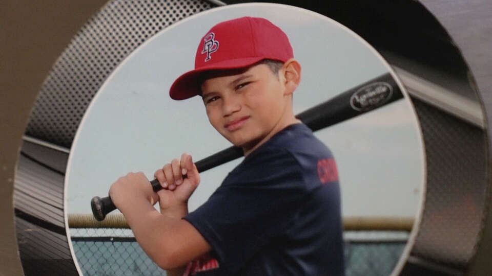 Israel is seen in a baseball photo on the family’s refrigerator. Luis was detained on his way to work on October, 24, 2025 and is being held at a U.S. Immigration and Customs Enforcement facility in Conroe, TX.