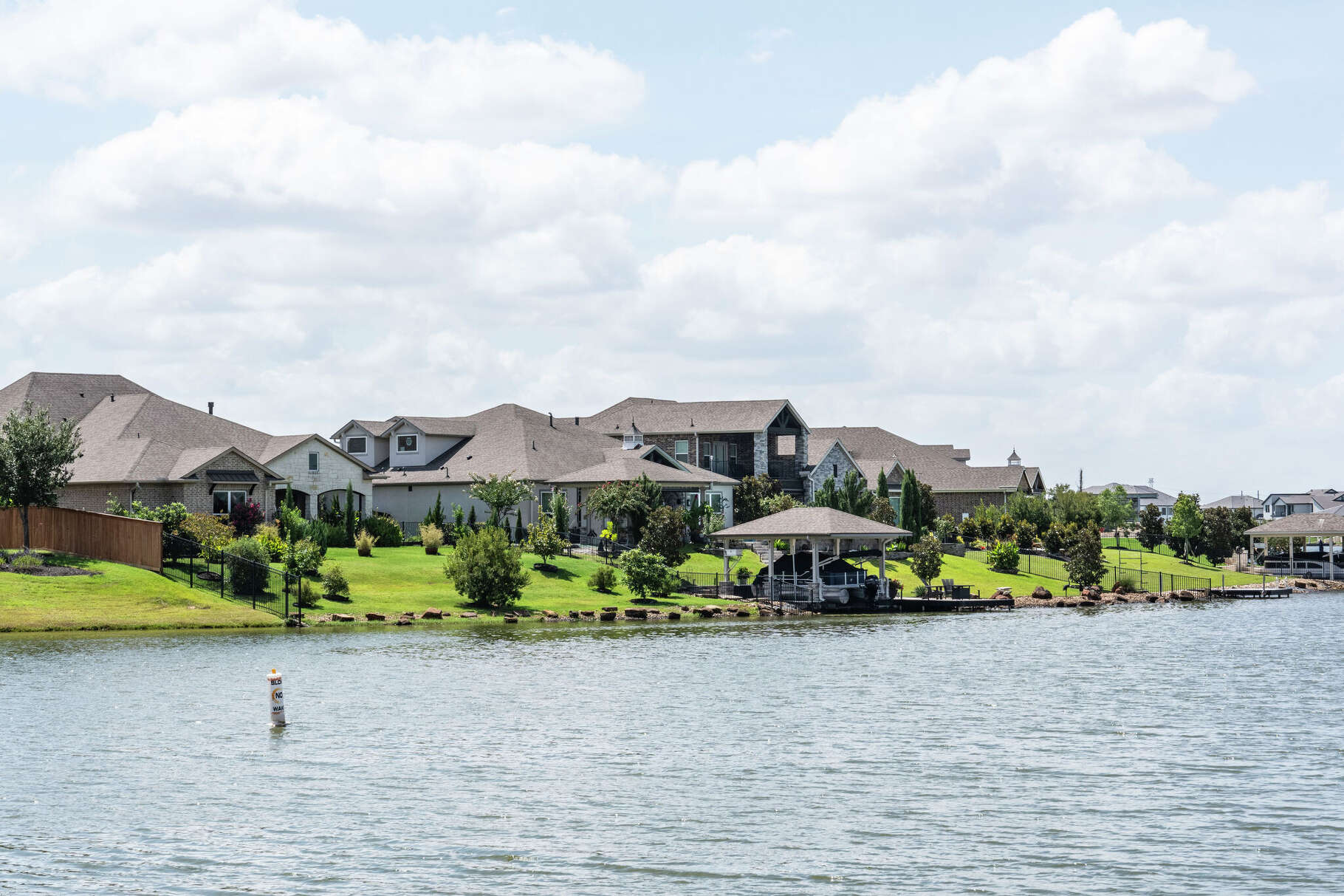 Homes and signage associated with the Towne Lake subdivision are seen in Cypress, Friday, Aug. 29, 2025.