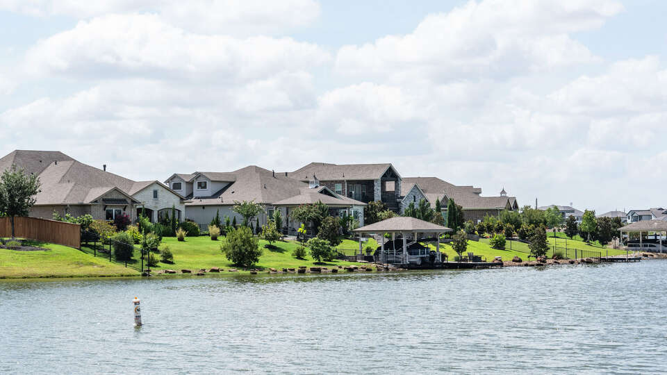 Homes and signage associated with the Towne Lake subdivision are seen in Cypress, Friday, Aug. 29, 2025.