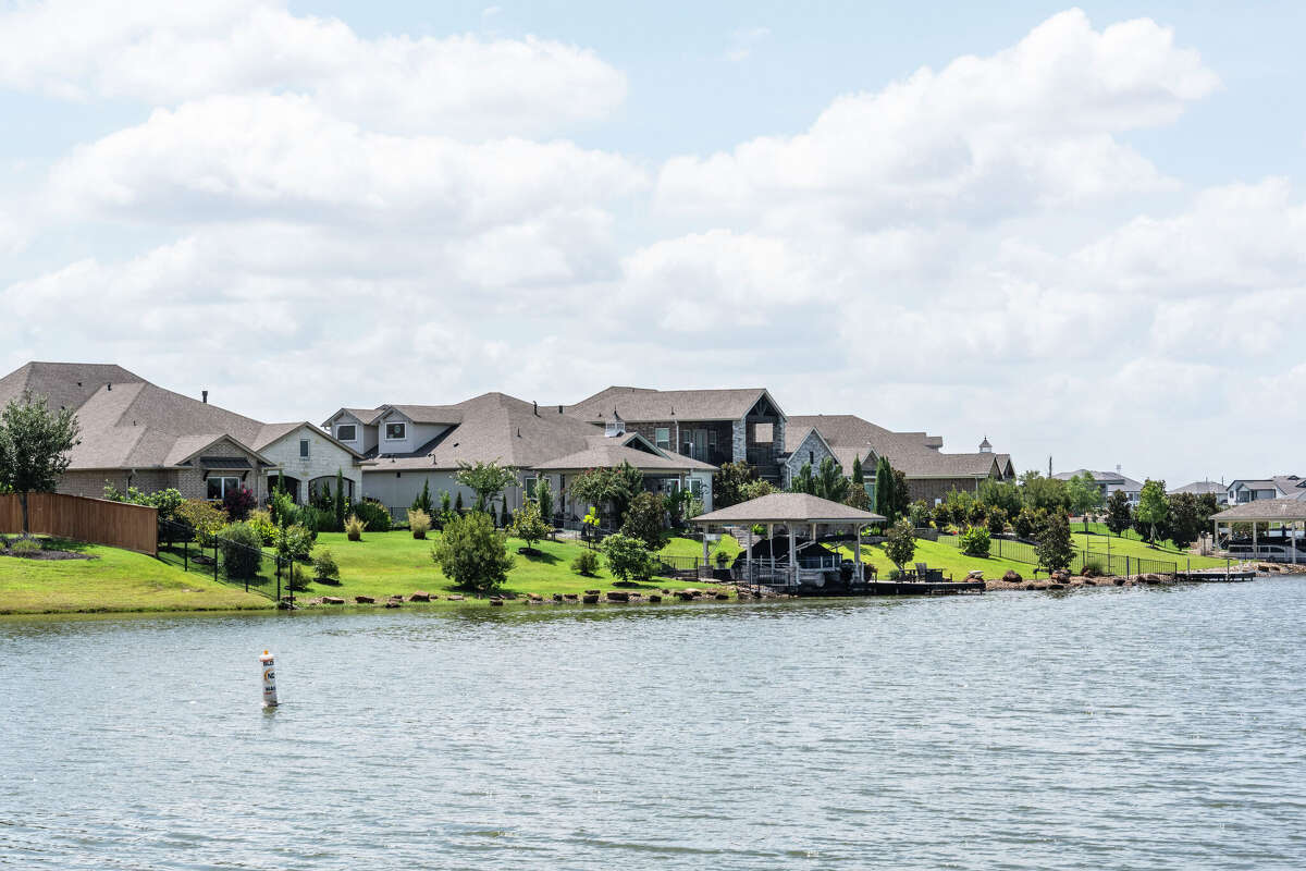 Homes and signage associated with the Towne Lake subdivision are seen in Cypress, Friday, Aug. 29, 2025.