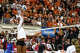 Texas Longhorns outside hitter Torrey Stafford (4) spikes the ball during the NCAA Regional Final volleyball match against Wisconsin at Gregory Gym on Sunday, Dec. 14, 2025 in Austin.