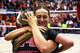 Wisconsin setter Morgan Van Wie (8) hugs setter Charlie Fuerbringer (24) after beating the Texas Longhorns in the NCAA Regional Final volleyball match at Gregory Gym on Sunday, Dec. 14, 2025 in Austin.