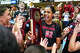 Wisconsin middle blocker Carter Booth (52) holds the NCAA Regional Championship trophy after beating the Texas Longhorns in the NCAA Regional Final volleyball match at Gregory Gym on Sunday, Dec. 14, 2025 in Austin.