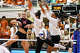 Texas Longhorns outside hitter Cari Spears (23) and middle blocker Taylor Harvey (10) miss a spike by Wisconsin outside hitter Mimi Colyer (15) during the NCAA Regional Final volleyball match at Gregory Gym on Sunday, Dec. 14, 2025 in Austin.