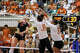 Texas Longhorns outside hitter Cari Spears (23) and middle blocker Taylor Harvey (10) miss a spike by Wisconsin outside hitter Mimi Colyer (15) during the NCAA Regional Final volleyball match at Gregory Gym on Sunday, Dec. 14, 2025 in Austin.