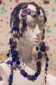 A headpiece and choker made of paillettes and chain is seen on display in the “Particles of Color: Where Science Meets Fashion” exhibit at the Texas Science and Natural History Museum in Austin, Thursday, Dec. 11, 2025.