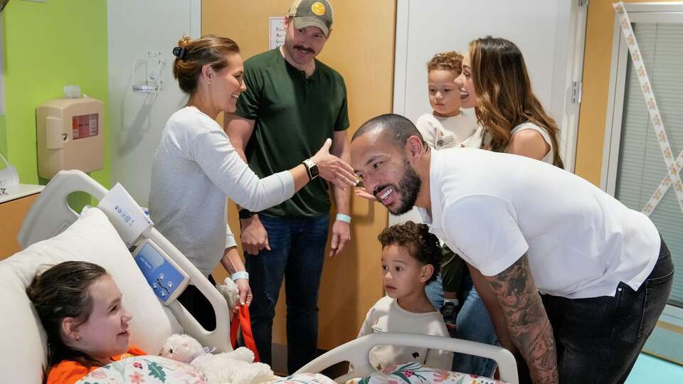 Astros third baseman Carlos Correa and his family visit with patients at the Texas Children's Hospital in The Woodlands and their families..