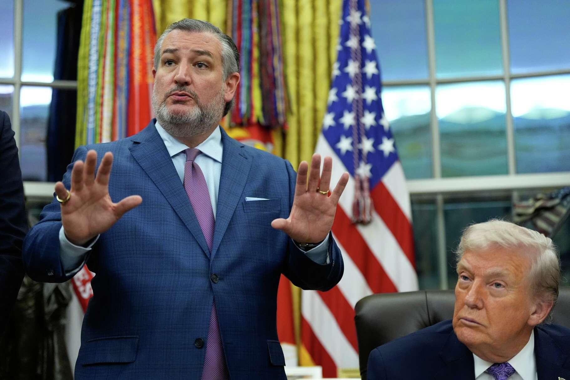 Ted Cruz R-Texas, left, speaks during a signing ceremony regarding AI initiatives with President Donald Trump in the Oval Office of the White House, Thursday, Dec. 11, 2025, in Washington.