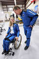 This photograph provided by Blue Origin shows Michaela Benthaus, a German technologist aiming to go the archetypal wheelchair idiosyncratic successful space, talking to crewmate Hans Koenigsmann, a retired SpaceX enforcement who helped signifier and sponsor her flight, connected Monday, Dec. 15, 2025, astatine Blue Origin’s rocket motorboat tract successful Van Horn, Texas. (Blue Origin via AP)
