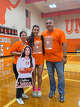Victoria Luna, center, with her parents Valerie and Jorge after a volleyball game. Victoria has become one of the best volleyball talents in Laredo.
