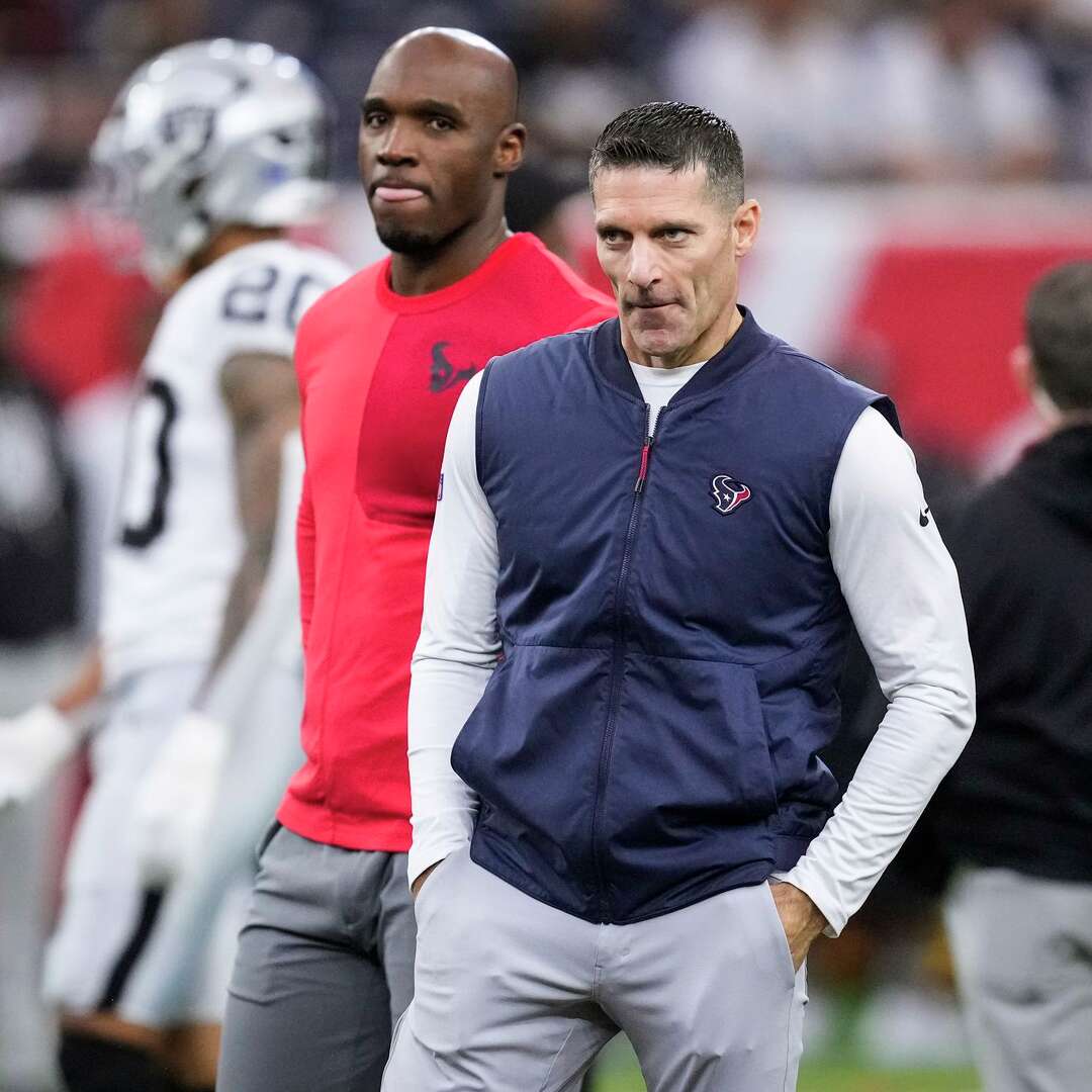 Houston Texans head coach DeMeco Ryans, left, and general manager Nick Caserio watch their team warm up before an NFL football game against the Las Vegas Raiders at NRG Stadium in Houston, Sunday, Dec. 21, 2025.