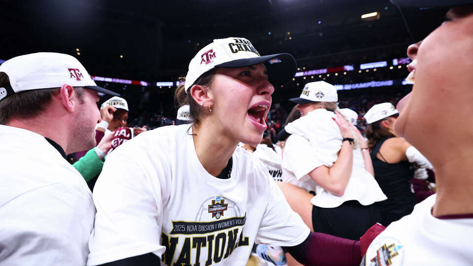 Logan Lednicky celebrates Texas A&M's win over Kentucky for the NCAA volleyball title.