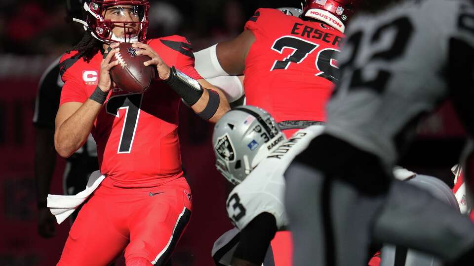 Houston Texans quarterback C.J. Stroud (7) looks for a teammate to pass to against the Las Vegas Raiders at NRG in Houston on Sunday, Dec. 21, 2025.