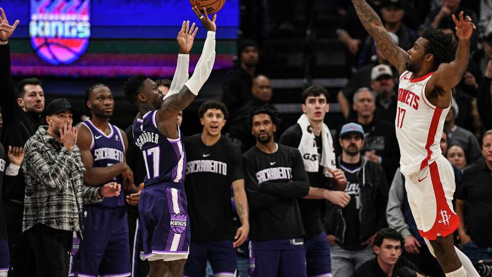 Sacramento Kings guard Dennis Schroder (17) makes a three point shot during overtime period of an NBA basketball game against the Houston Rockets, Sunday, Dec. 21, 2025, in Sacramento, Calif. (AP Photo/Justine Willard)