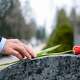 Red flower on tombstone at cemetery