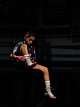 Lily Hernandez, 11, laces up her shoes as she gets ready to spar against another gym at Let ‘Em Fly Boxing in Kyle, Texas, Nov. 13, 2025. The sparring night was set up with another Central Texas gym to help athletes get sharp ahead of the USA Boxing National Championships.