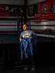 Coach Fabian Hernandez, tidies up the gym ahead of practice at Let ‘Em Fly Boxing in Kyle, Texas, Dec. 19, 2025. Hernandez founded the gym after training his own kids, both national-caliber youth boxers out of his garage.