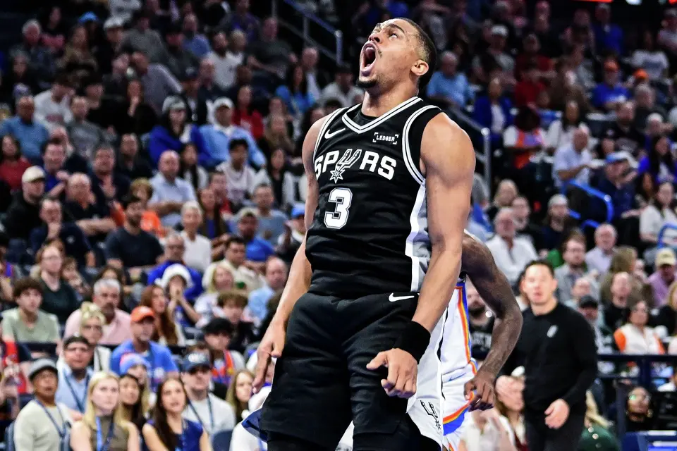 San Antonio Spurs Keldon Johnson (3) celebrates against the Oklahoma City Thunder during the first half of an NBA basketball game, Thursday, Dec. 25, 2025, in Oklahoma City. (AP Photo/Gerald Leong)