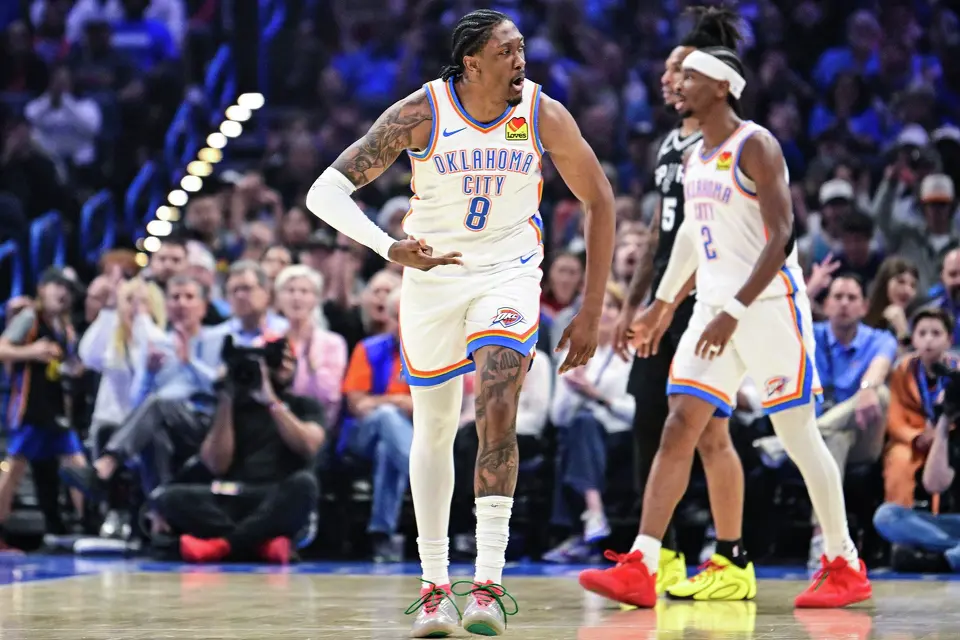 Oklahoma City Thunder Jalen Williams (8) gestures against the San Antonio Spurs during the first half of an NBA basketball game, Thursday, Dec. 25, 2025, in Oklahoma City. (AP Photo/Gerald Leong)