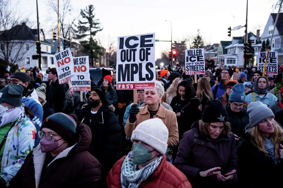 People participate in a protest and vigil after an Immigration and Customs Enforcement officer shot and killed a woman in Minneapolis, on Wednesday, Jan. 7, 2026. (Christopher Katsarov/The Canadian Press via AP)