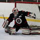 Cheshire goalie Ryan Miller (35) deflects a Greenwich puck during boys' high school hockey action in Greenwich, Conn., on Saturday January 25, 2025.