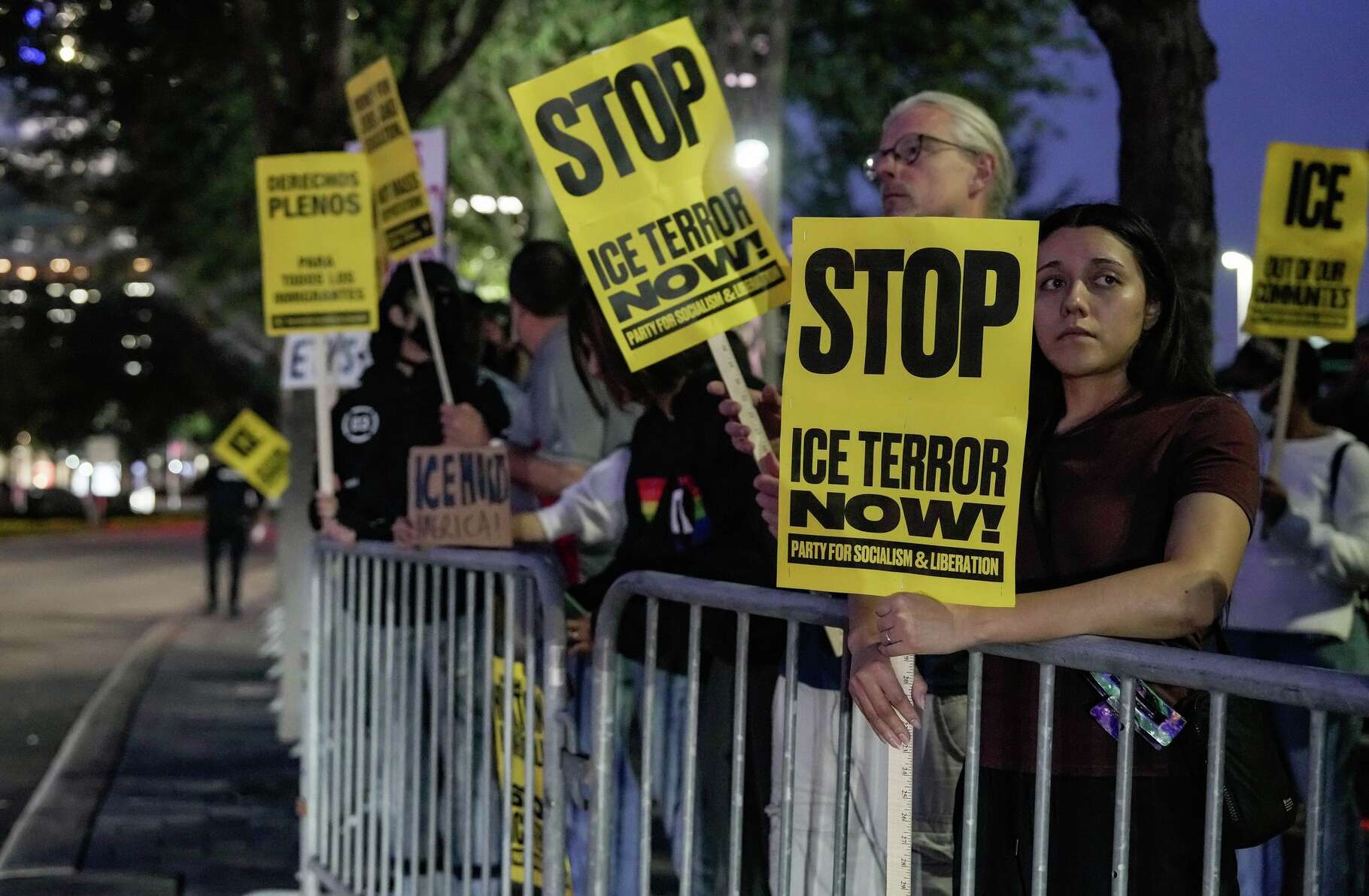 People gather to protest the recent killing of Renee Nicole Good in Minneapolis by an ICE agent, in Houston, Thursday, Jan. 8, 2026.